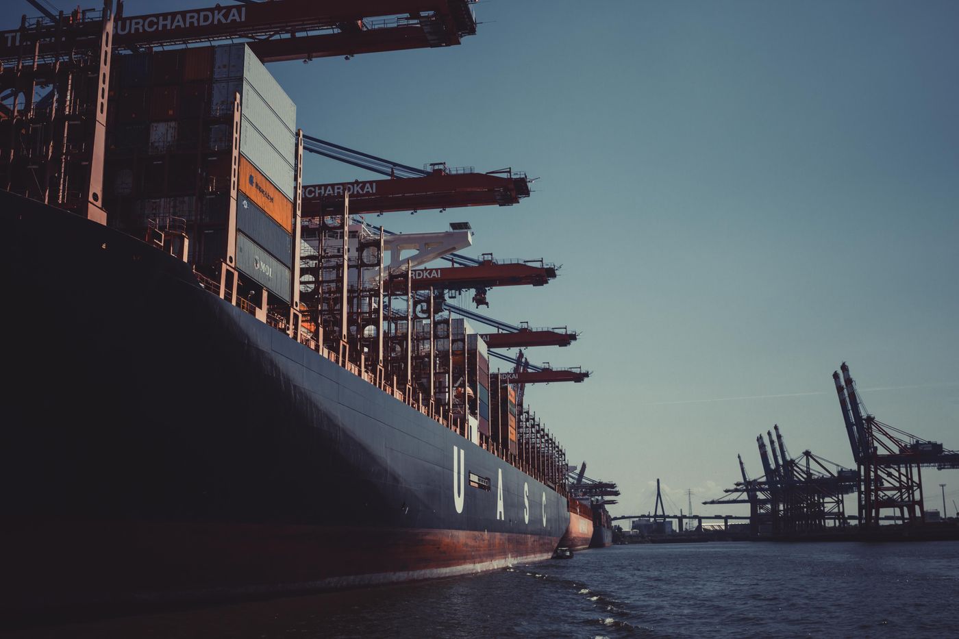 Container ship being loaded at a harbor
